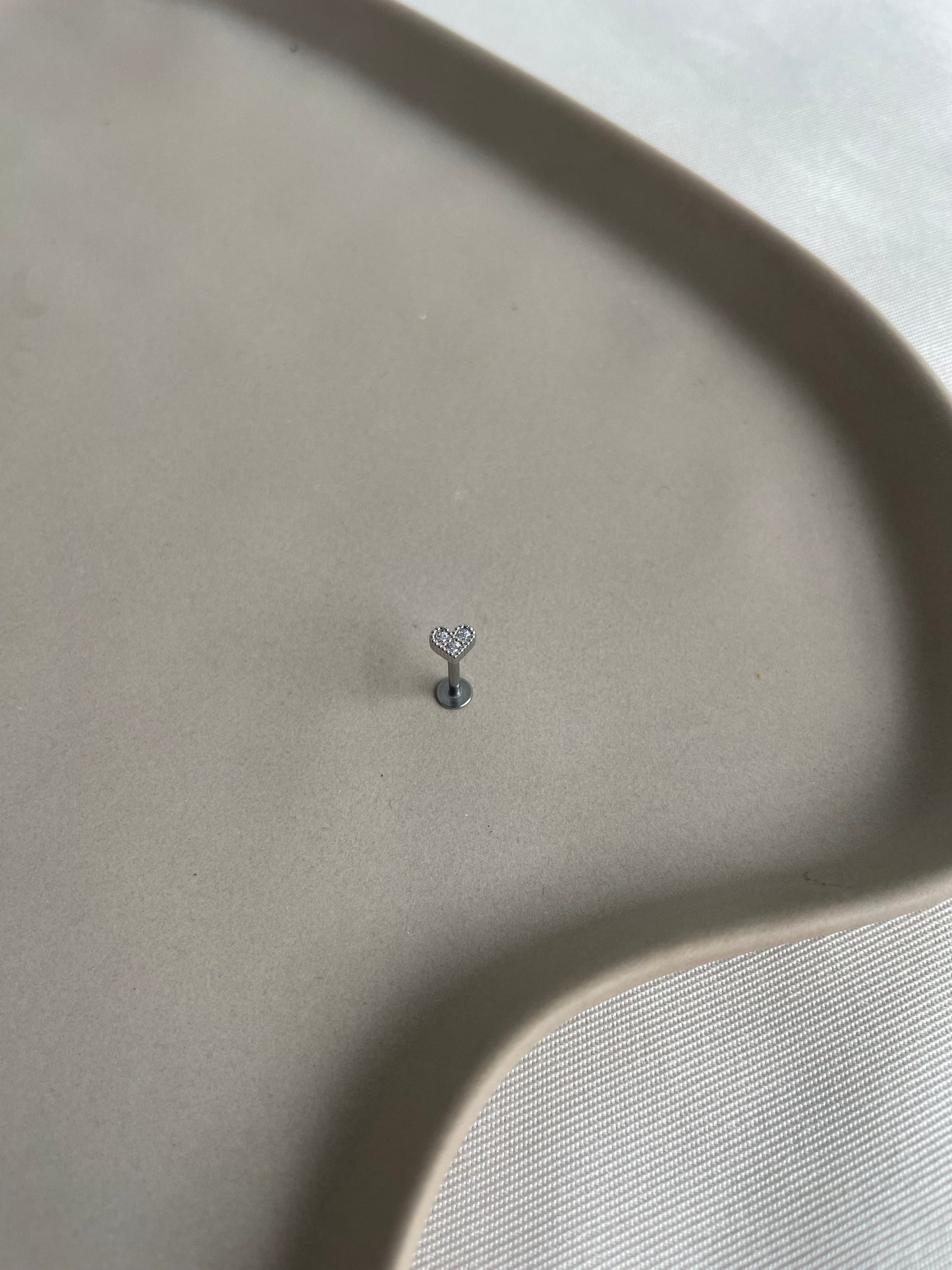 Piercing silver heart