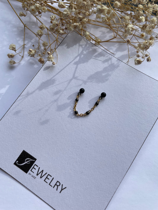 The black connected earring