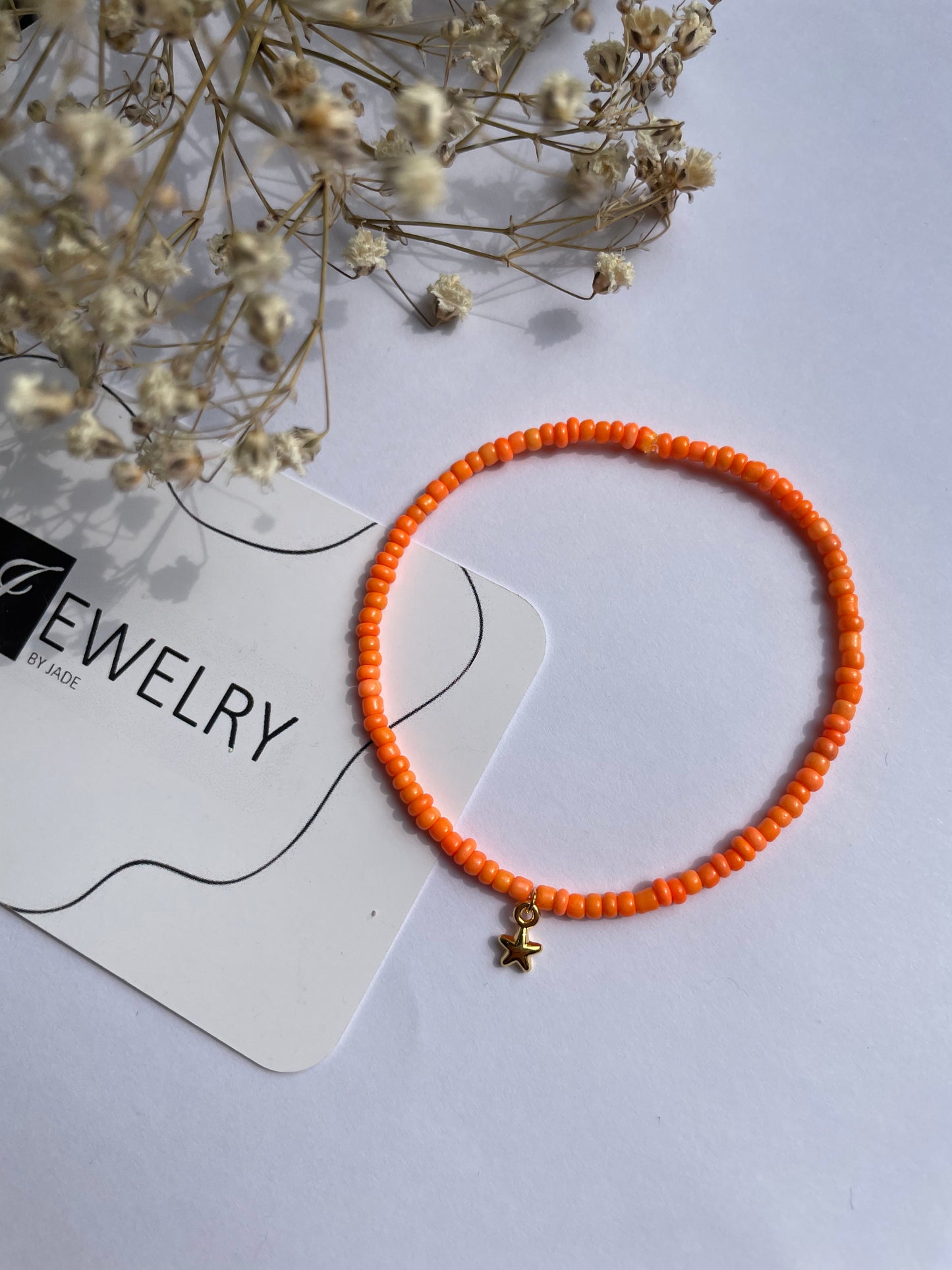 Armbandje oranje mini